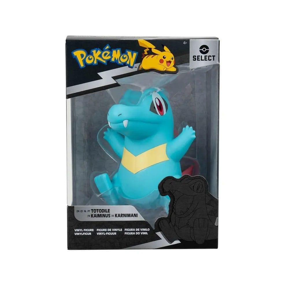 Figurine en vinyle de Kaiminus (Totodile) dans sa boîte Pokémon Select. Le Pokémon est représenté en bleu avec une pose dynamique et joyeuse, dans un packaging noir et argent avec logo Pikachu.