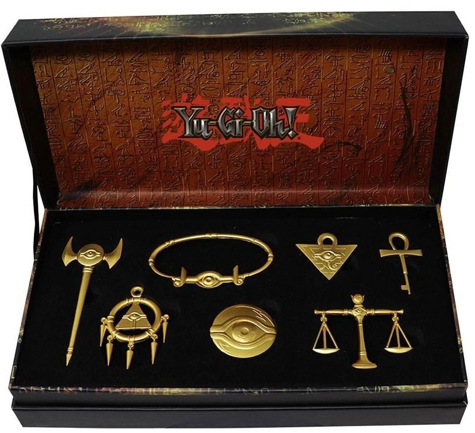 Coffret premium Yu-Gi-Oh! répliques officielles des 7 Objets du Millénium en métal doré