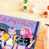 CreArt Ravensburger KPop Demon Hunters HUNTR/X, peinture par numéros 18 x 24 cm avec les trois héroïnes du groupe sur fond violet.