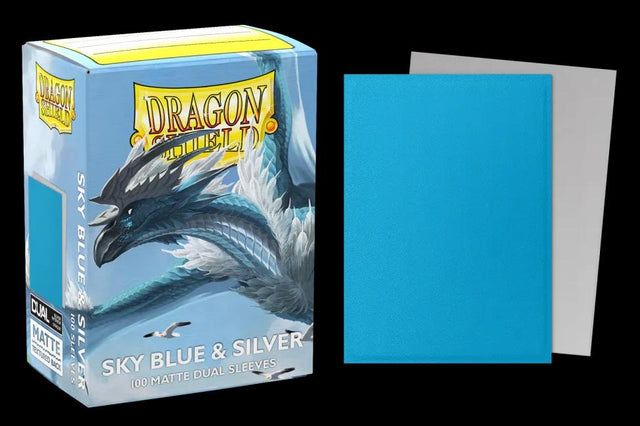 Boîte Dragon Shield Dual Matte Sky Blue & Silver contenant 100 protège-cartes standard bleu ciel avec intérieur argenté et finition mate.