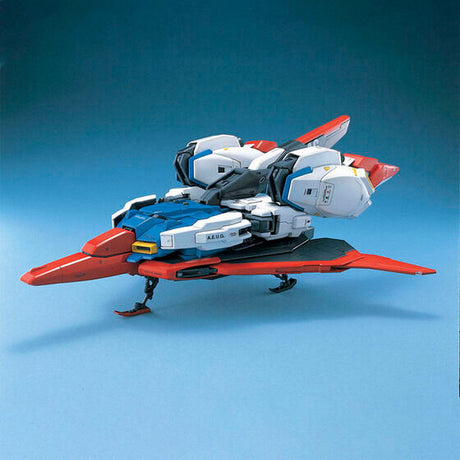 Maquette Gunpla PG 1/60 Zeta Gundam bleue, blanche, rouge et jaune avec fusil et bouclier, sur fond blanc.