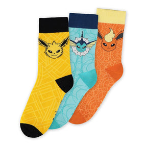Pack de 3 chaussettes Pokémon représentant Jolteon, Vaporeon et Flareon sur fond jaune, bleu et orange respectivement.