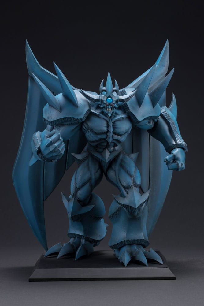 Figurine Yu-Gi-Oh! Obelisk the Tormentor Egyptian God, monstre bleu massif avec ailes repliées, poing serré et socle d’exposition.