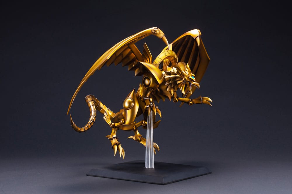 Figurine Yu-Gi-Oh! The Winged Dragon of Ra Egyptian God, dragon doré aux ailes déployées sur socle transparent.